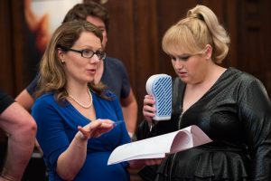 Screenwriter Dana Fox chats with Rebel Wilson during production on the set of How To Be Single