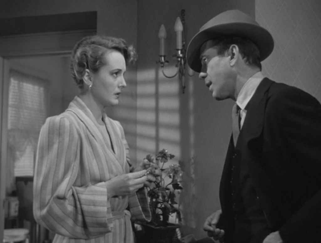 Humphrey Bogart speaks to Mary Astor wryly in The Maltese Falcon. Photo Courtesy: Warner Bros